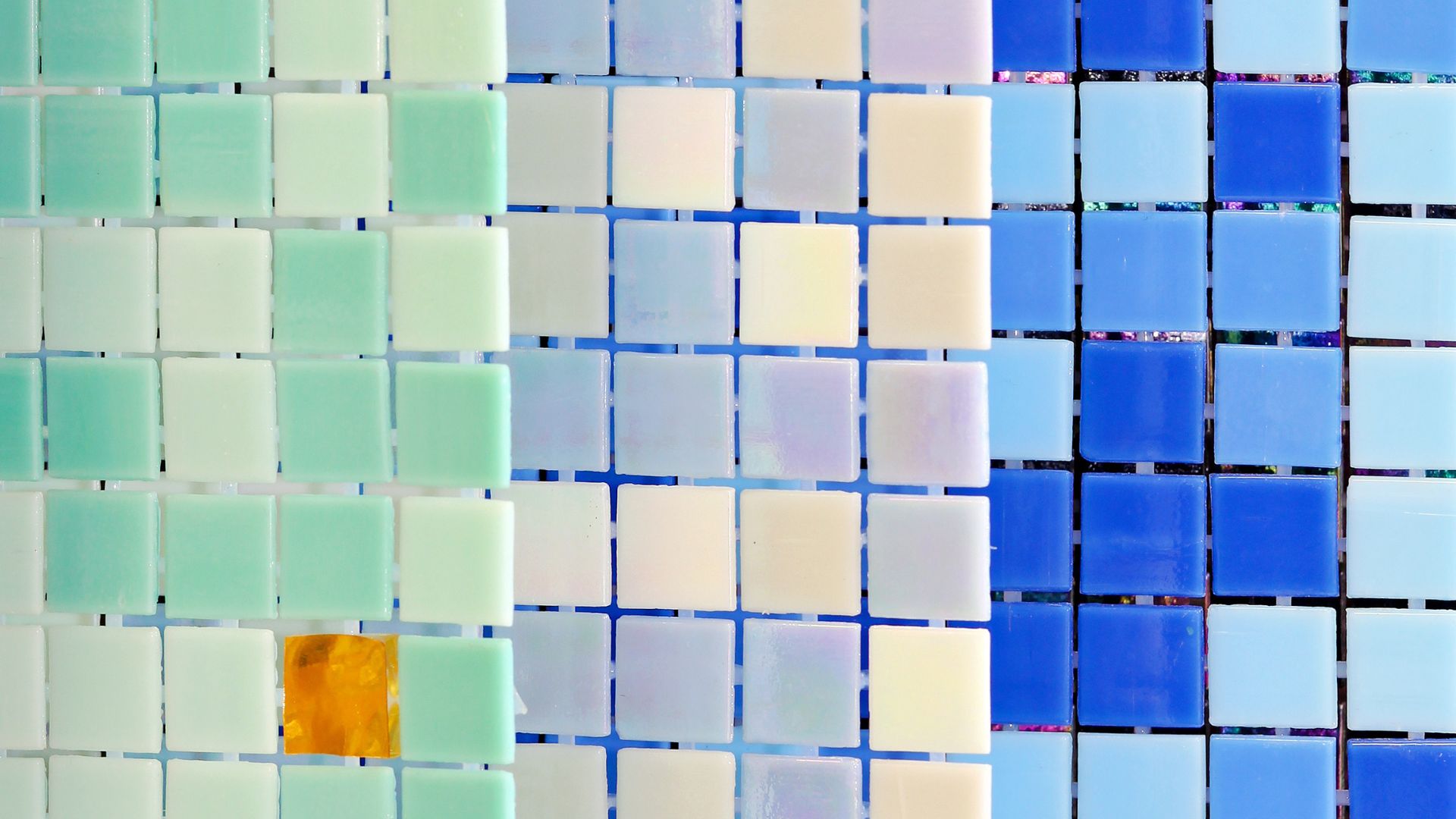 Mosaic tiles gradient from green to blue with single yellow square